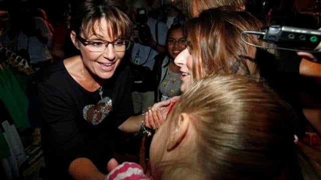 Former Alaska Gov. Sarah Palin greets supporters at The Machine Shed restaurant, in Urbandale, Iowa, Friday, Sept. 2, 2011.  