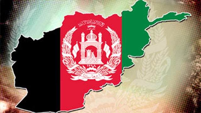 Afghan security forces near entrance gate of a NATO compound following a suicide bombing in Kabul, July 2, 2013  