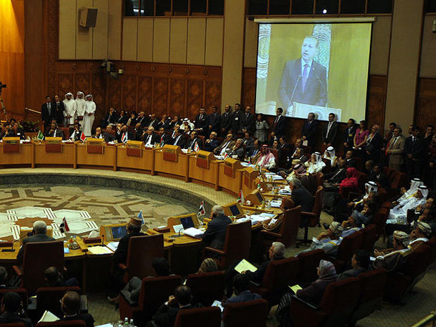 Turkish prime minister Recep Tayyip Erdogan is seen on a screen as he gives a speech to the Arab league members during an Arab league meeting in its headquarters in Cairo, Egypt, Sept. 13, 2011. 