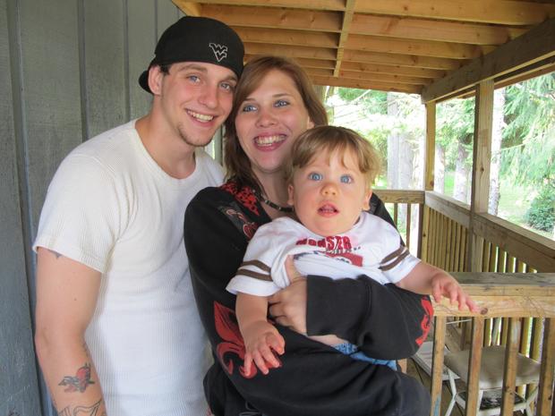 Thomas McDaniel, left, Brandi Wells, and her 10-month-old son Logan Tanner Wells 