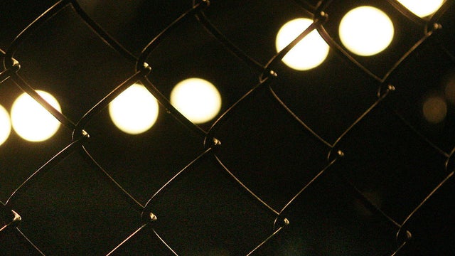Two boys fight each other during a cage fight in this image capture taken from a video shown on sharefight.com. 