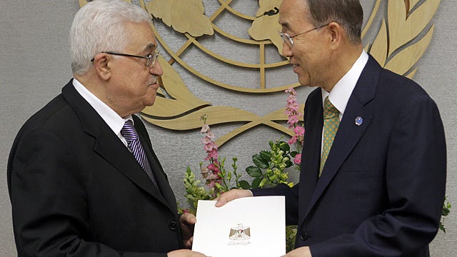 Palestinian President Mahmoud Abbas, left, gives a letter requesting recognition of Palestine as a state to Secretary-General Ban Ki-moon during the 66th session of the General Assembly at United Nations headquarters, Sept. 23, 2011.  