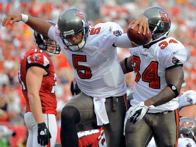 Josh Freeman celebrates with teammates 
