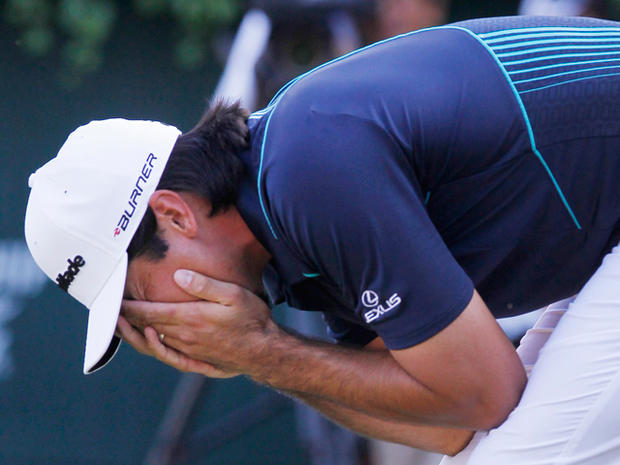 Jason Day reacts after missing his birdie putt 