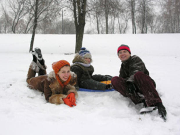 12/23/11 - A Guide To Twin Cities' Sledding Hills - Family in snow 
