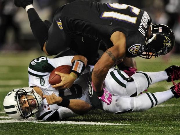 BALTIMORE, MD - OCTOBER 2: Quarterback Mark Sanchez #6 of the New York Jets is hit by linebacker Brendon Ayanbadejo #51 of the Baltimore Ravens during the second quarter at M&amp;T Bank Stadium on October 2, 2011 in Baltimore, Maryland. (Photo by Patrick Smith/Getty Images) 