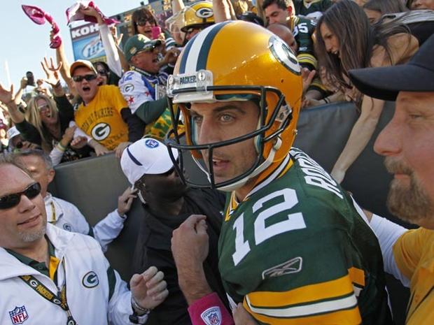 GREEN BAY, WI - OCTOBER 2: Aaron Rodgers #12 of the Green Bay Packers exits the stands after scoring a touchdown against the Denver Broncos at Lambeau Field on October 2, 2011 in Green Bay, Wisconsin. (Photo by Matt Ludtke /Getty Images) 