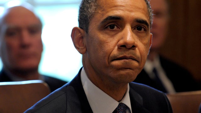 President Obama listens as a reporter asks a question at the start of a Cabinet meeting at the White House in Washington Oct. 3, 2011. 