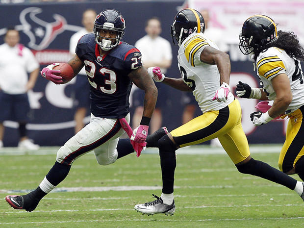 Arian Foster is pursued by Troy Polamalu 
