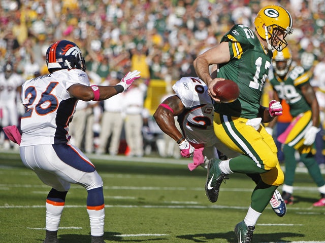 Aaron Rodgers scores a touchdown  