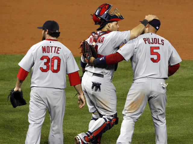 Jason Motte, Yadier Molina, Albert Pujols celebrate 