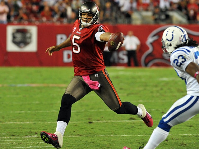 Josh Freeman runs for a gain 