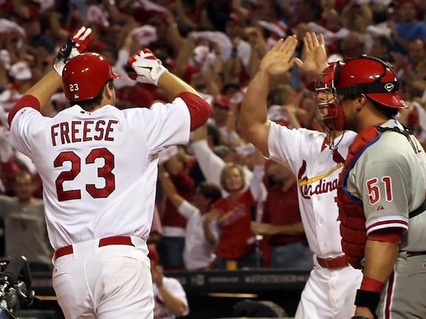 ST LOUIS, MO - OCTOBER 05: David Freese #23 of the St. Louis Cardinals celebrates with teammate Matt Holliday #7 after Freese hits a two-run home run in the sixth inning off pitcher Roy Oswalt #44 of the Philadelphia Phillies in Game Four of the National League Division Series at Busch Stadium on October 5, 2011 in St Louis, Missouri. (Photo by Jamie Squire/Getty Images) 