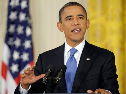 President Barack Obama gestures during a news conference in the East Room of the White House in Washington, Thursday, Oct. 6, 2011. 