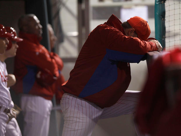 Roy Halladay reacts in the dugout  