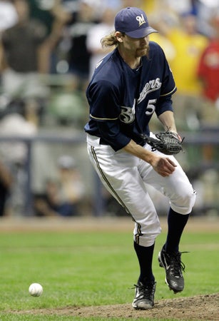 John Axford is hit by a ball  