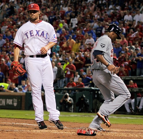 Austin Jackson scores on a wild pitch  