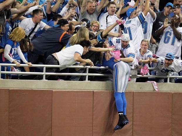 DETROIT, MI - OCTOBER 10: Calvin Johnson #81 of the of the Detroit Lions celebrates his touchdown reception by leaping into the stands during their game against the Chicago Bears at Ford Field on October 10, 2011 in Detroit, Michigan. (Photo by Gregory Shamus/Getty Images) 