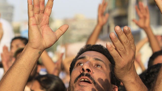 Angry Egyptian Christians protest against the military ruling council in Cairo Egypt, Oct.10, 2011, a day after at least more than two dozen were killed when Christians, angered by a recent church attack, clashed Sunday night with Muslims and security for 