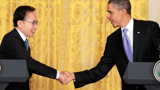 President Barack Obama and South Korean President Lee Myung-bak shake hands during their joint news conference in the East Room at the White House in Washington, Thursday, Oct. 13, 2011. 