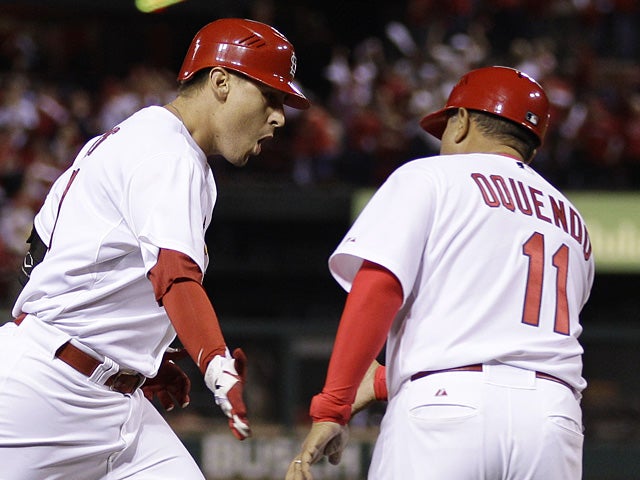 Jose Oquendo congratulates Allen Craig after homering 