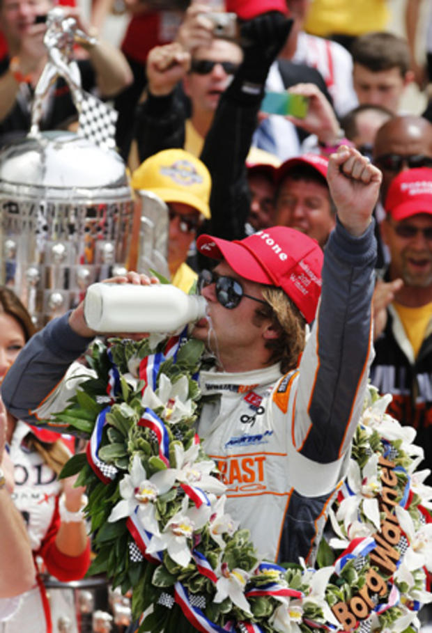 Dan Wheldon celebrates after winning the Indianapolis 500 