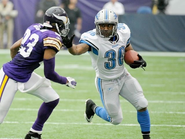 MINNEAPOLIS, MN - SEPTEMBER 25: Cedric Griffin #23 of the Minnesota Vikings looks to tackle as Jerome Harrison #36 of the Detroit Lions carries the ball in the third quarter on September 25, 2011 at Hubert H. Humphrey Metrodome in Minneapolis, Minnesota. The Lions defeated the Vikings 26-23. (Photo by Hannah Foslien/Getty Images) 