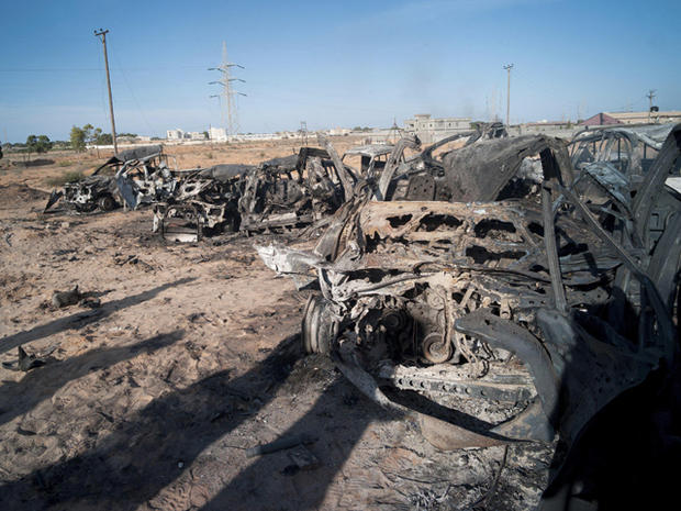 The wreckage of burnt vehicles 