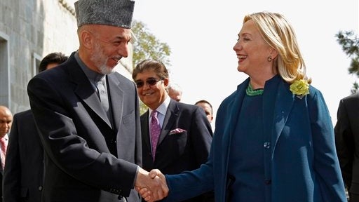 U.S. Secretary of State Hillary Rodham Clinton meets with Afghan President Hamid Karzai at the Presidential Palace in Kabul, Afghanistan, Thursday, Oct. 20, 2011. Clinton was calling for a new, three-way partnership between the U.S., Afghanistan and Pakis 
