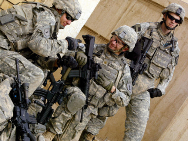 US soldiers share a moment as they patro 
