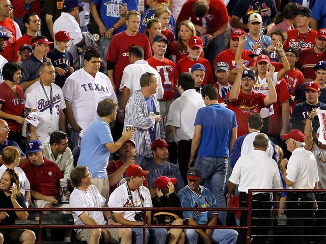 fan is escorted out by security 