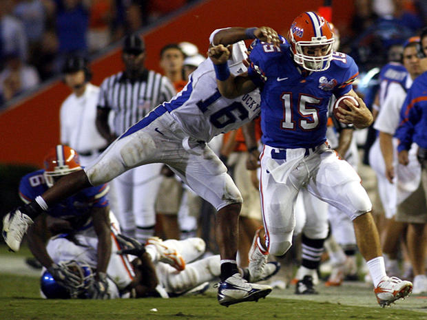 Tim Tebow breaks a tackle  