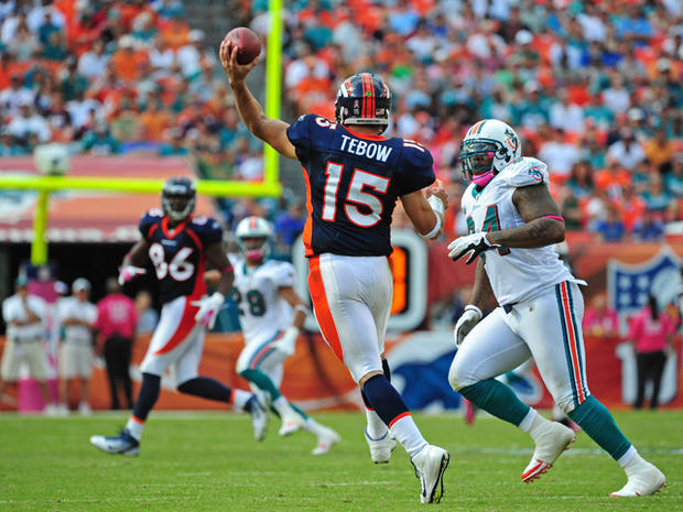 Tim Tebow passes against the Dolphins 