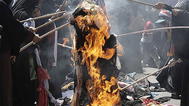 Yemeni women burn their veils during a demonstration demanding the resignation of Yemeni President Ali Abdullah Saleh in Sanaa, Yemen, Oct. 26, 2011.  