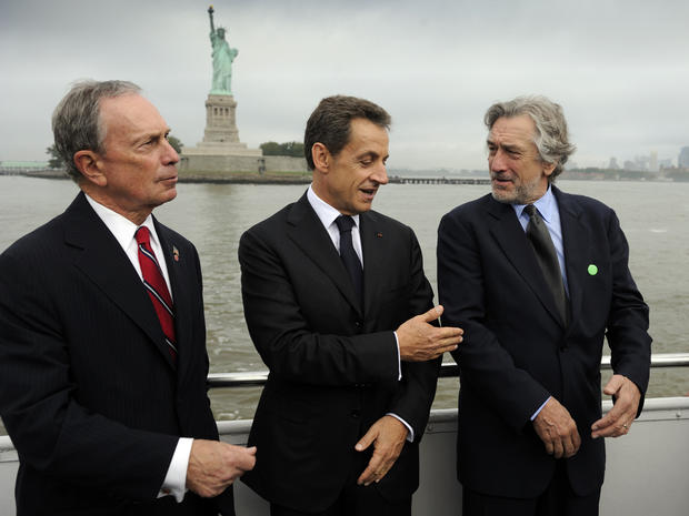 French President Nicolas Sarkozy, center, talks with New York Mayor Michael Bloomberg, left, and actor Robert de Niro as they travel to the celebration of the 125th anniversary of the Statue of Liberty's dedication Sept. 22, 2011, in New York. 