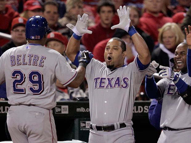Adrian Beltre is congratulated after hitting a home run 