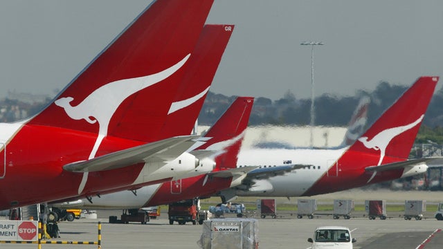 Qantas jetliners are seen parked at their terminal at Sydney Airport in Australia in July 13, 2003, file photo 