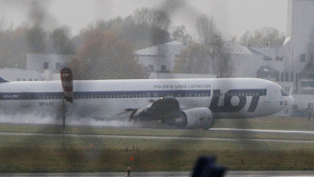 A Boeing 767 of Polish LOT airlines makes an emergency landing at Warsaw airport, Poland,Tuesday, Nov. 1, 2011.  