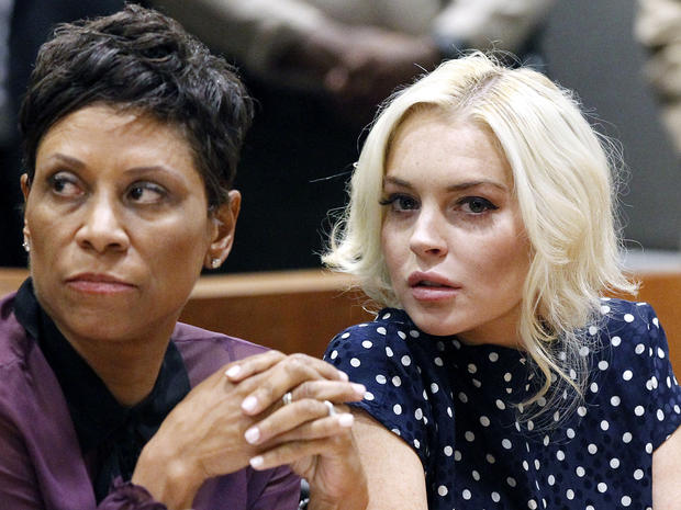 Lindsay Lohan and attorney Shawn Chapman Holley sit in court during Lohan's probation violation hearing Nov. 2, 2011, in Los Angeles. Lohan was sentenced to 300 days in jail to start Nov. 9, 2011, for violating her probation but will only serve 30 days if 