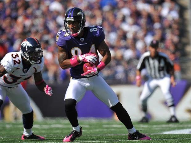 BALTIMORE, MD - OCTOBER 10: T.J. Houshmandzadeh #84 of the Baltimore Ravens makes a catch against the Denver Broncos at M&amp;T Bank Stadium on October 10, 2010 in Baltimore, Maryland. Players wore pink in recognition of Breast Cancer Awareness Month. The Ravens lead the Broncos at the half 17-7. (Photo by Larry French/Getty Images) 