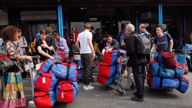 Foreign trekkers outside Katmandu airport after their flight was canceled 