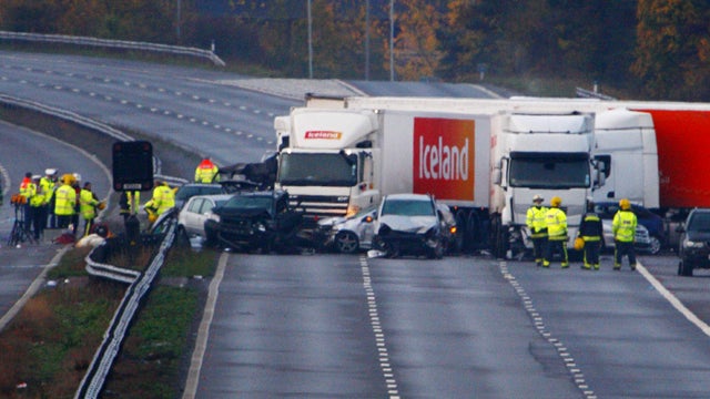 Scene on motorway close to Taunton, in southwestern England, early Saturday following 34-vehicle pileup late Friday 