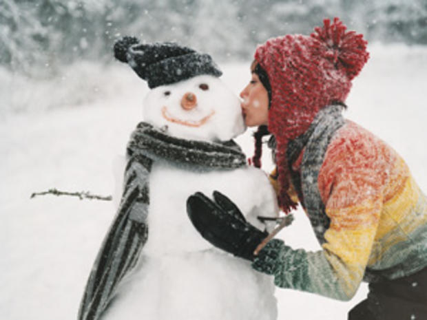 1/7/12 – Travel &amp; Outdoors – Best Places to Play in the Snow – girl with snow man 