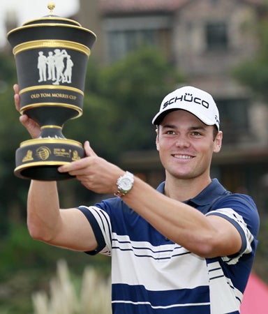 Martin Kaymer of Germany holds the champion trophy 