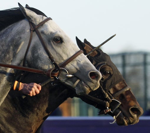 Julien Leparoux riding Turallure is passed by Robby Albarado riding Court Vision 