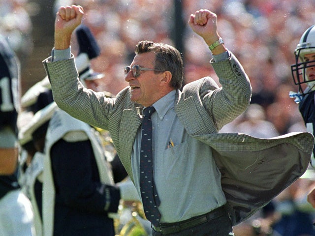 Joe Paterno cheers on his players 