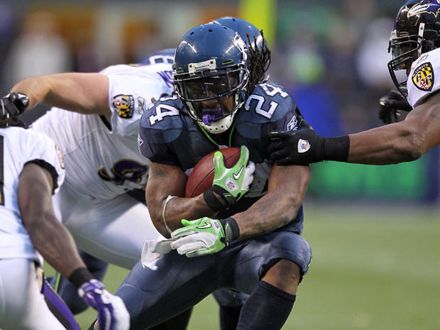 Marshawn Lynch rushes against the Ravens 