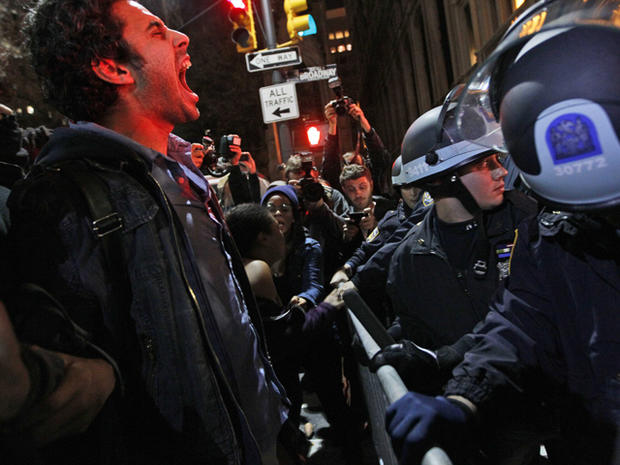 protester yells out at police after being ordered to leave Zuccotti Park 