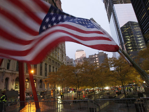 An American flag flies the empty Occupy Wall Street Encampment at Zuccotti Park   