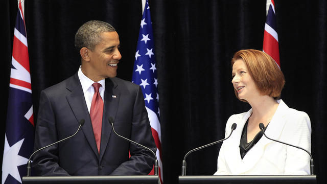 President Obama listens to Australian Prime Minister Julia Gillard 